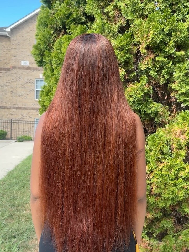 Mid half-up hairstyle with a sleek finish